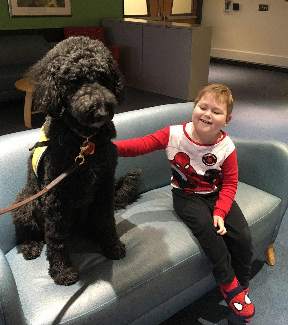 Brenner Patient with Pet Therapy Pup Bella