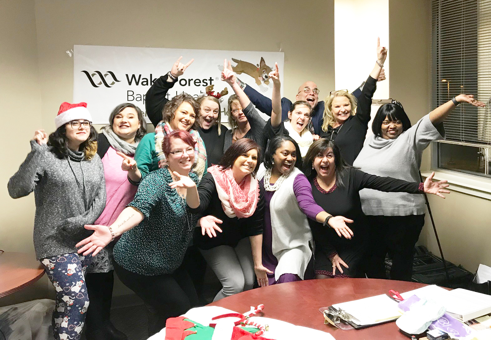 Employees of local Great Clips salons celebrate raising funds for Brenner Children's